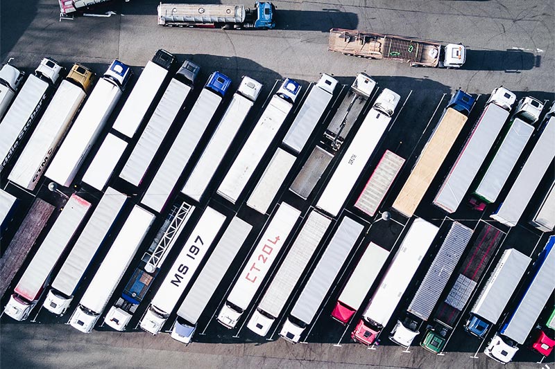 overhead shot of multiple transport trucks