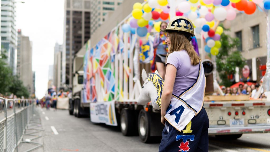 A U of T Engineering student with the Blue and Gold Committee's float at the 2010 Toronto Pride Parade