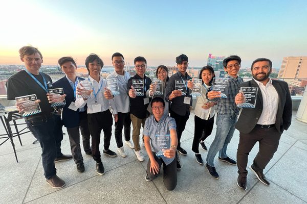 U of T Engineering's self-driving vehicle team, aUToronto showing their first place plaques for the AutoDrive Challenge™ II.