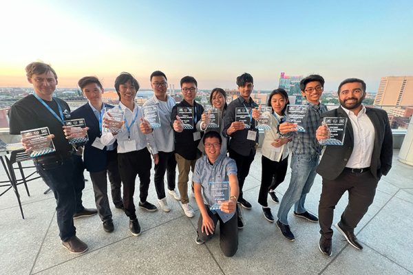 U of T Engineering's self-driving vehicle team, aUToronto showing their first place plaques for the AutoDrive Challenge™ II.