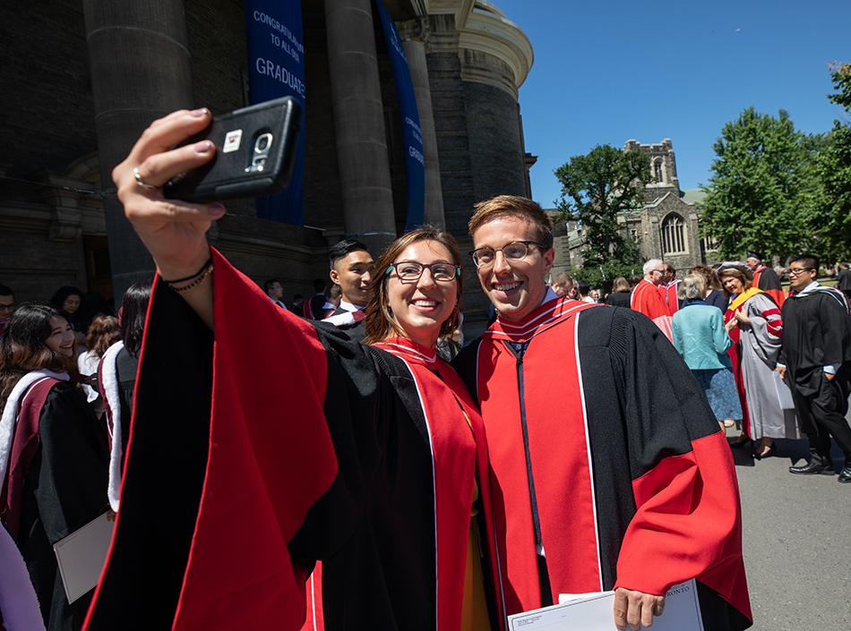 Students celebrating outside of Convocation Hall, University of Toronto