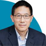 headshot of Chris Yip on blue semi-circle background