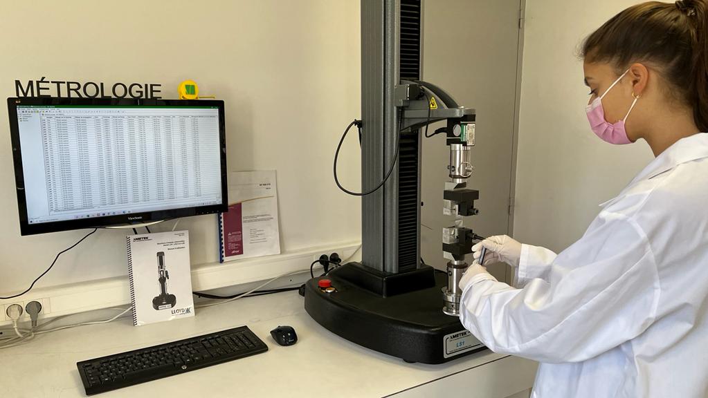 Carmelle Chatterjee wearing PPE working in a lab