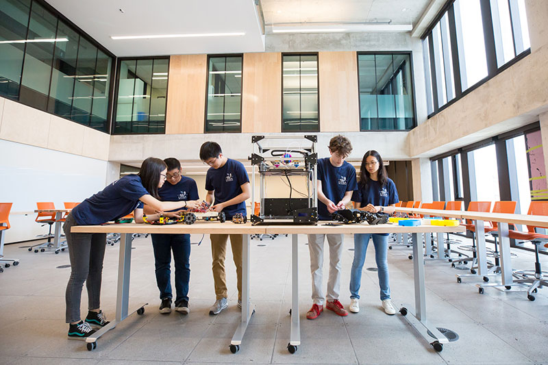 Members from Blue Sky Solar Racing Club working on their device.